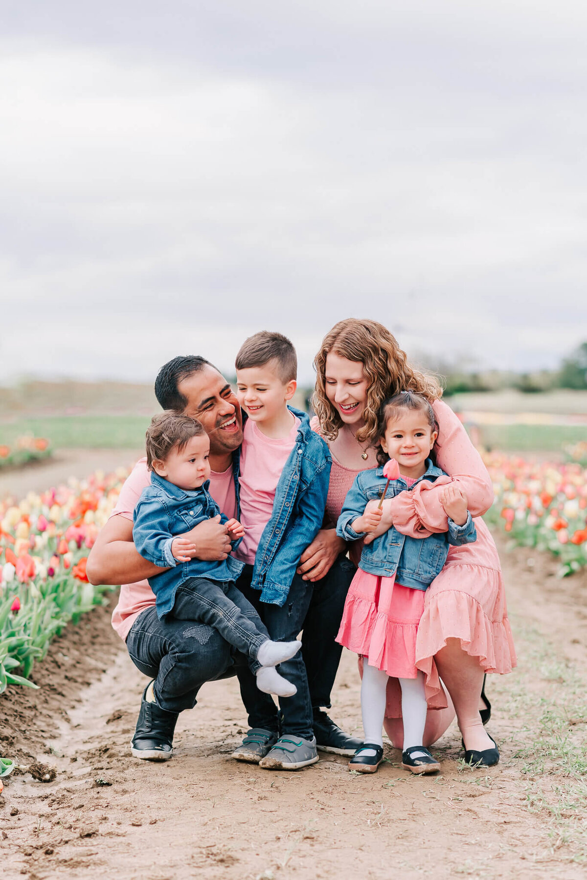 Spring family portrait with tulips at Burnside Farms in Northern Virginia