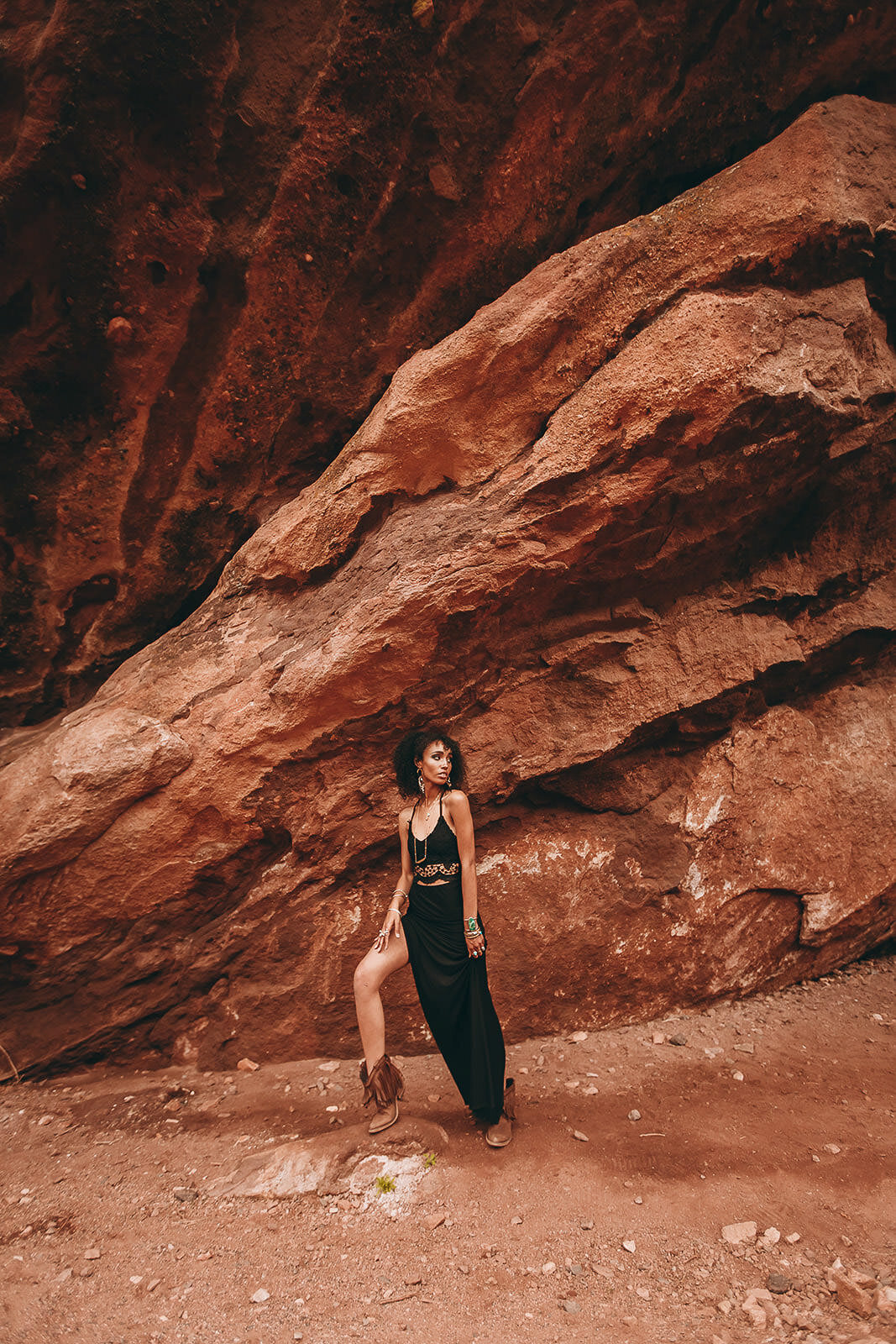 fashion girl standing at red rocks