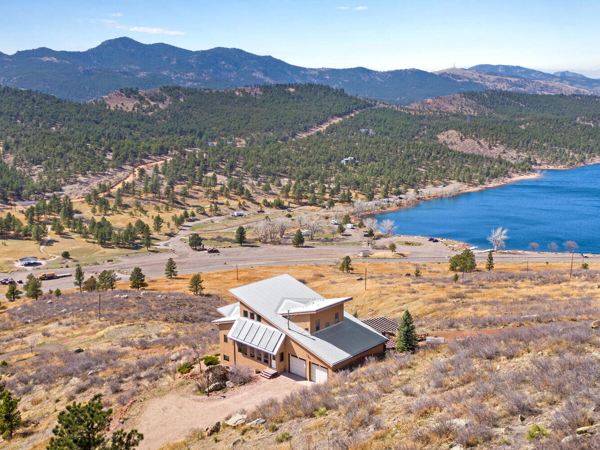 Modern Home Aerial Photograph with Lake