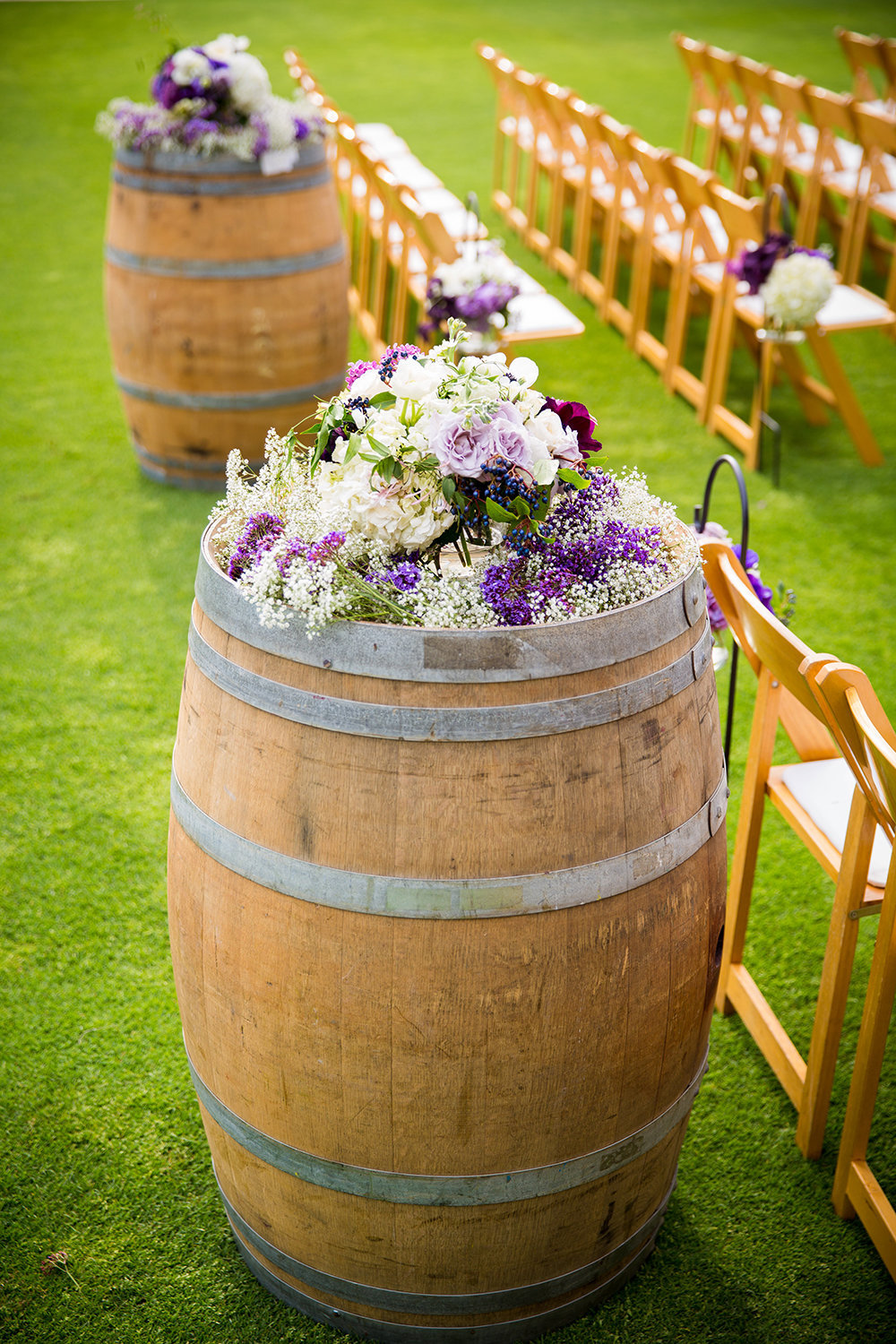 Sycuan wedding photos wine barrels with flowers rustic