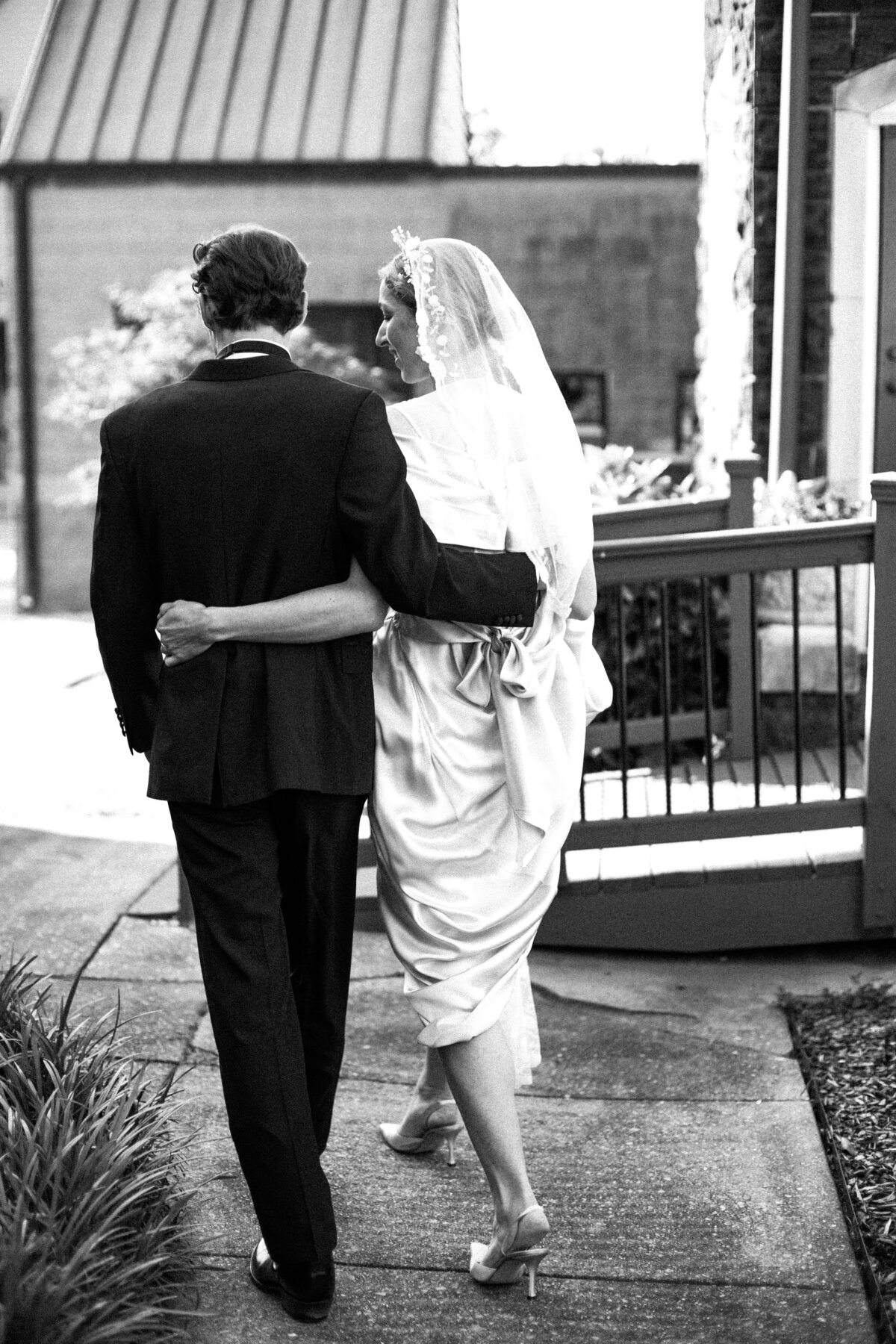 Bride and Groom looking happy in black and white photo