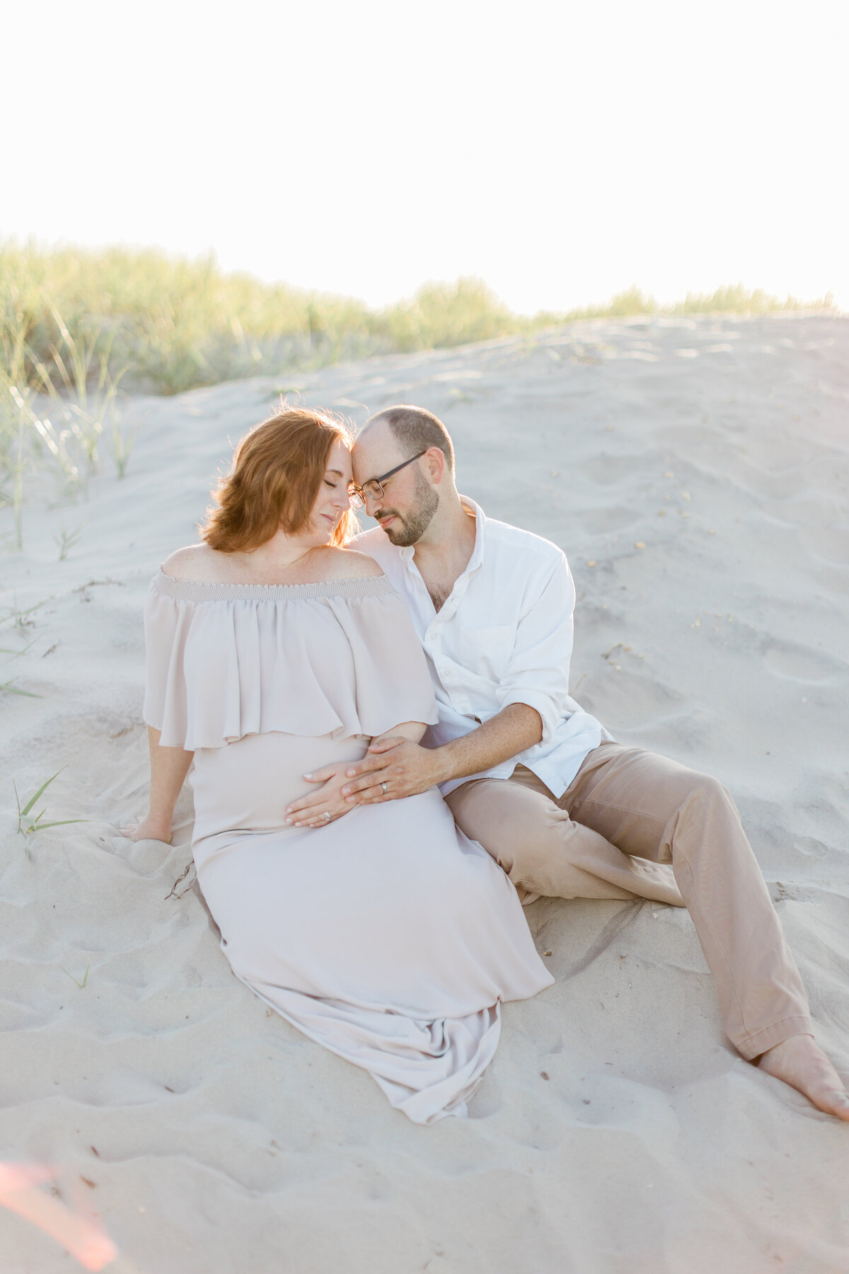 pregnant mom with her husband on the beach photographed by South Jersey Maternity Photographer