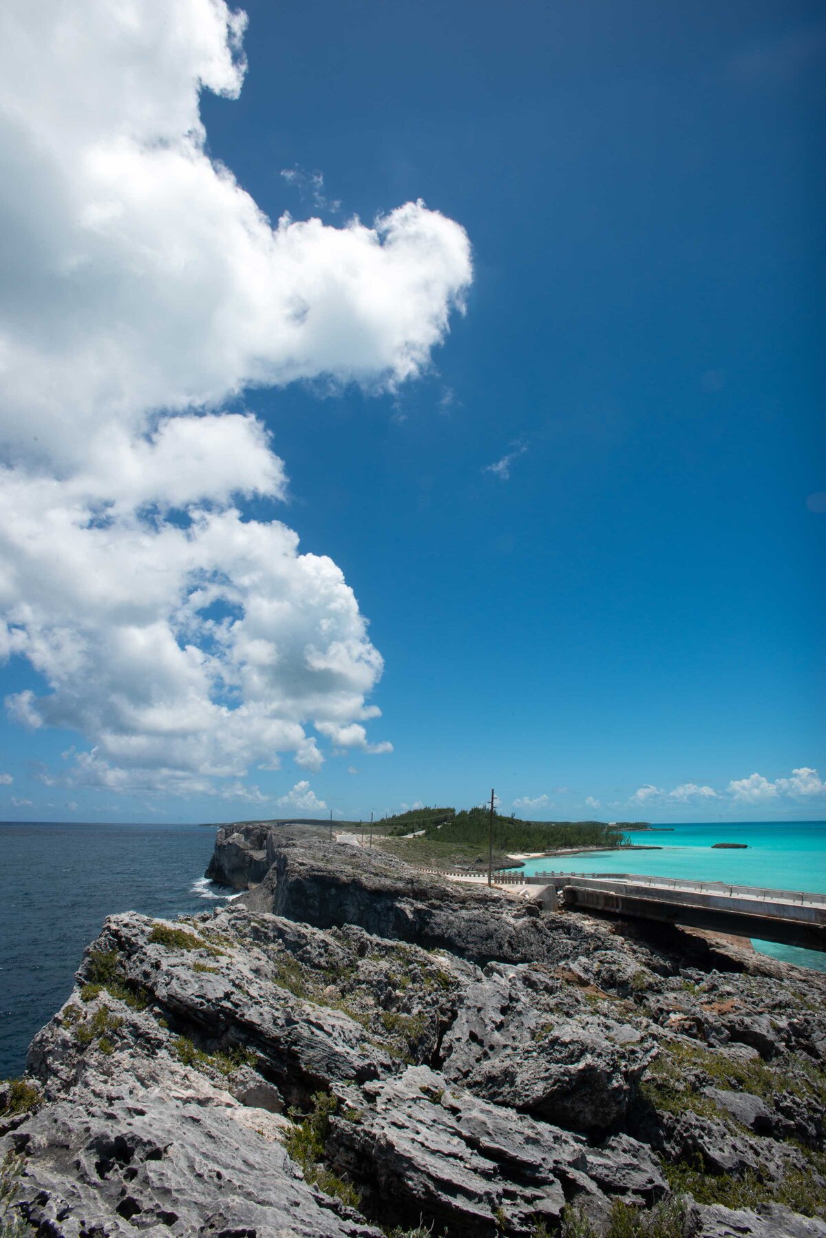 Volcanic rock juts out to separate two bodies of water on Eleuthera Bahamas