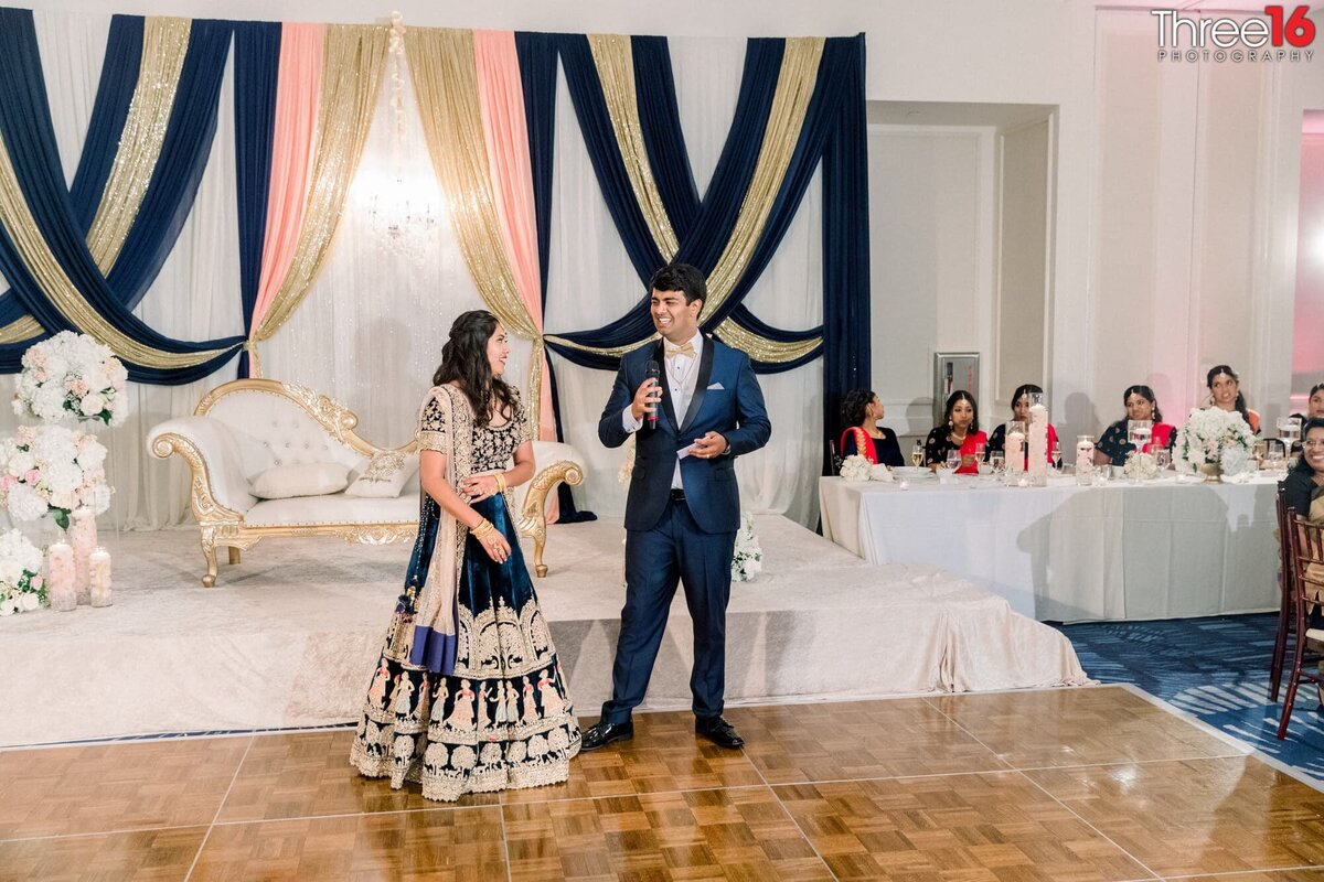 Groom toasts his Bride in front of all their wedding guests