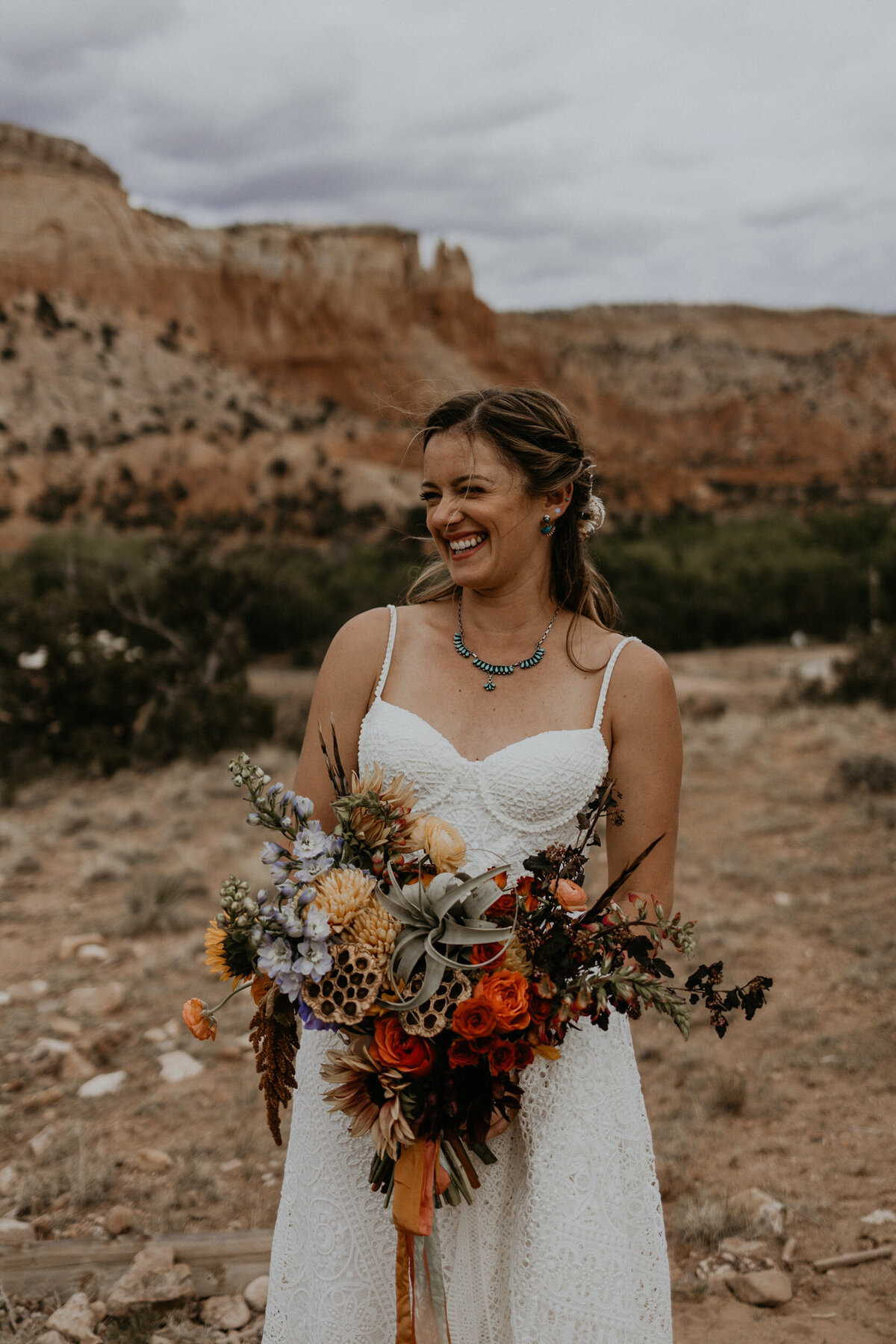 bride holding colorful southwest bouquet
