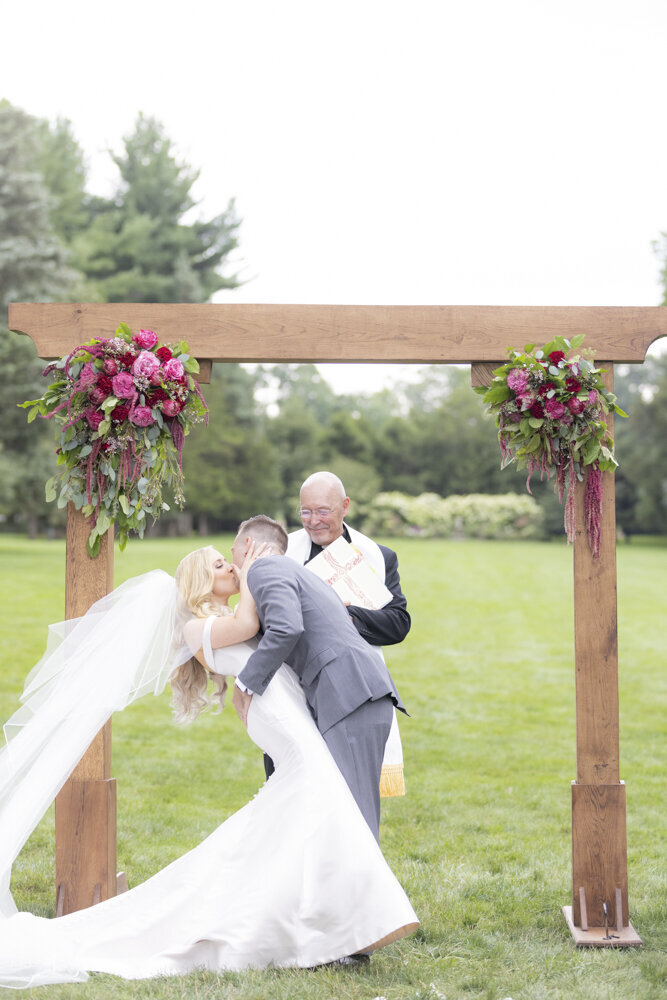 bride and groom kiss as husband and wife - Wadsworth Mansion wedding photographer Rachel Girouard