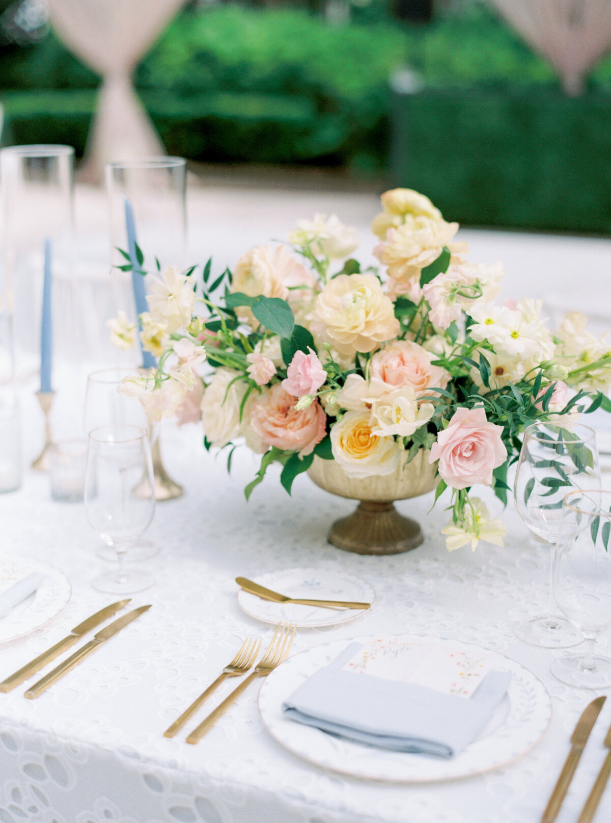 Charleston spring wedding reception. Light blue napkins and eye-hole table cloth.