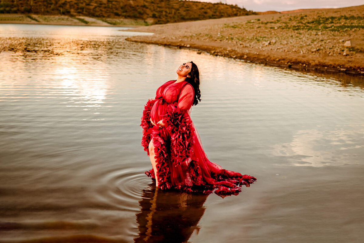Arizona mother-to-be wearing red dress for her lake maternity photos in Arizona