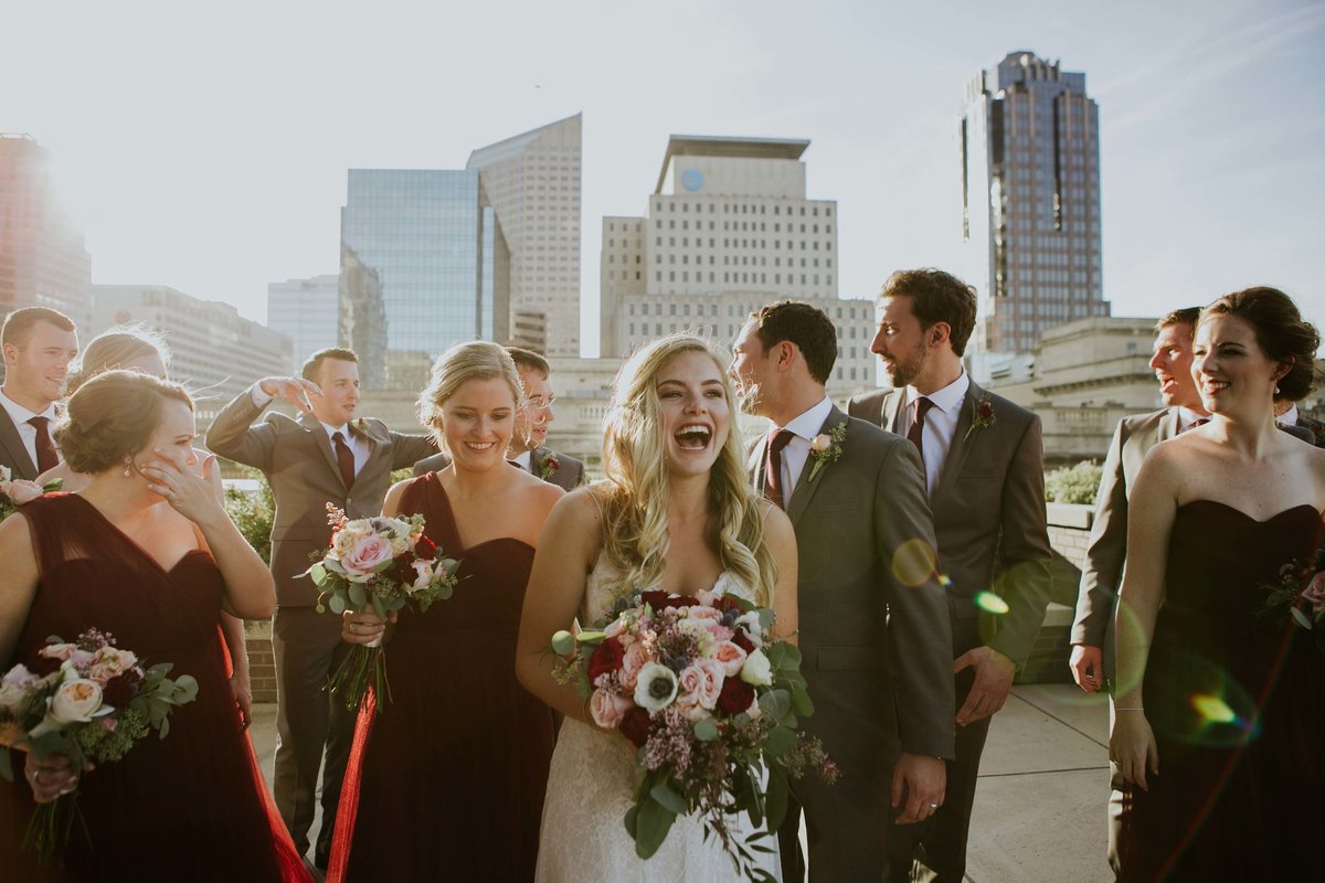 bride laughs on the regions tower rooftop in this Indianapolis photography