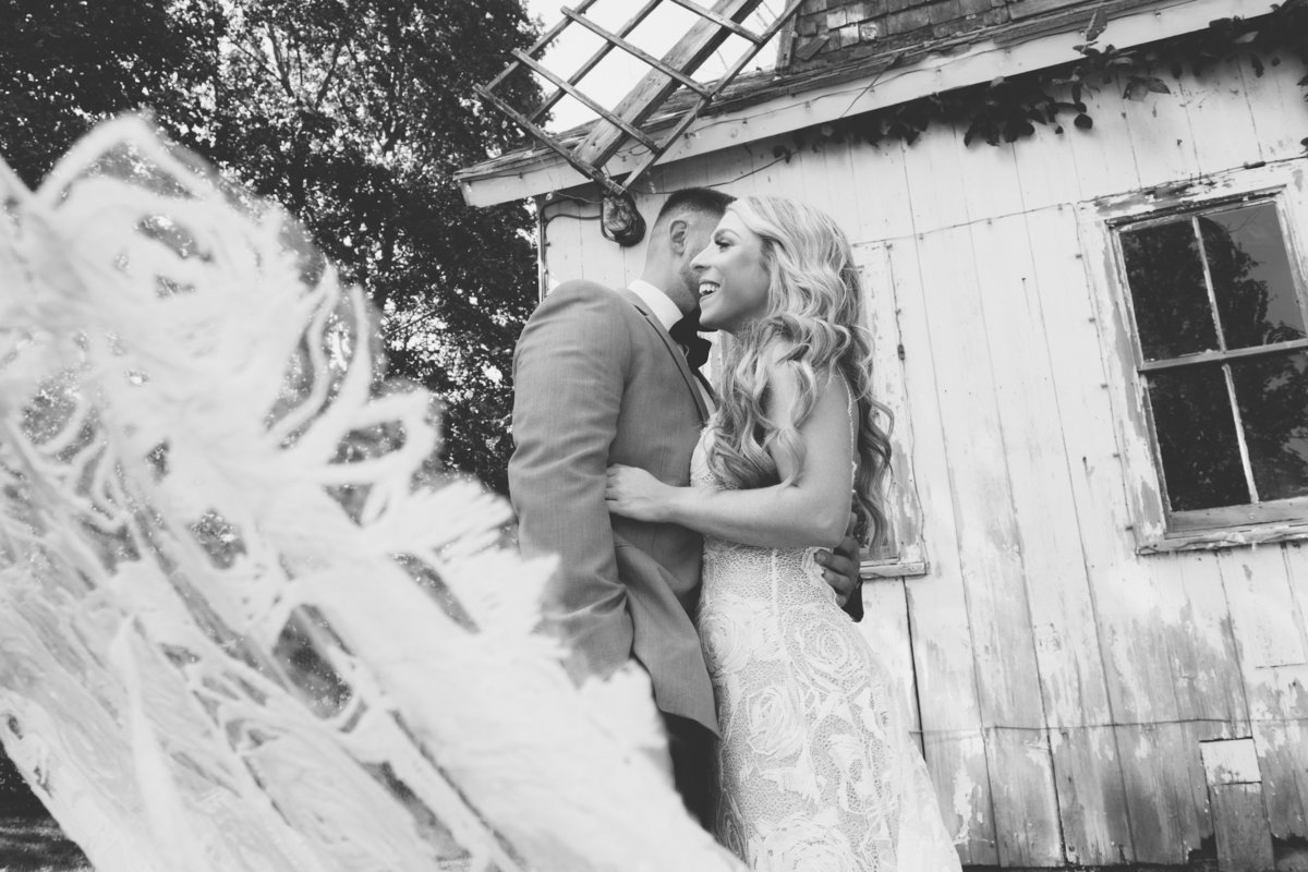 black and white photo of bride and groom outside Giorgios Baiting Hollow