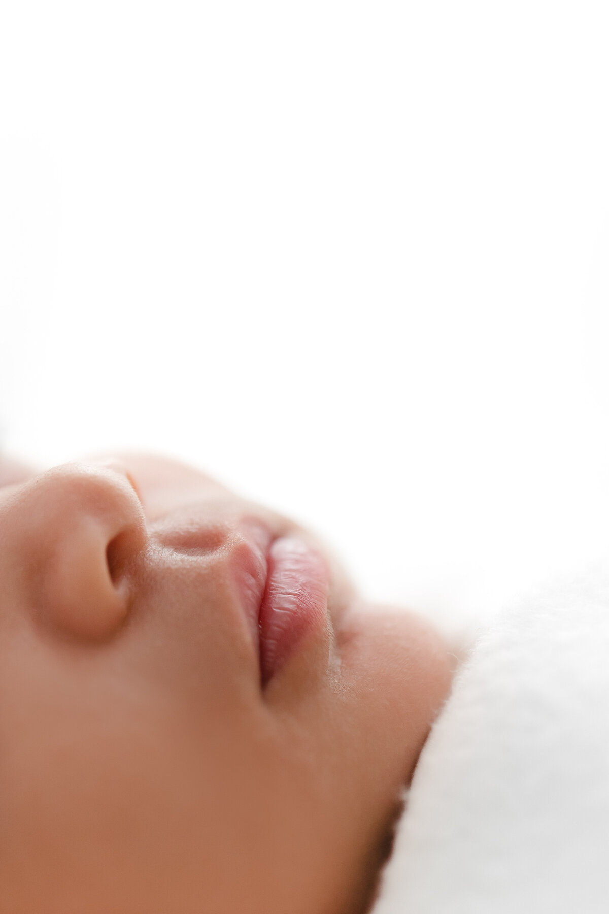 A closeup DC Newborn Photography photo of a baby girl's lips