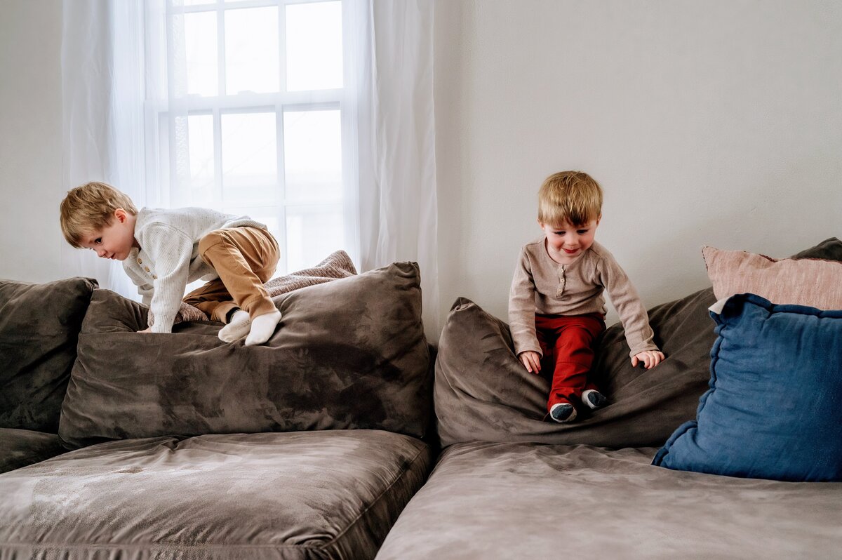 boys climbing on couch McKennaPattersonPhotography