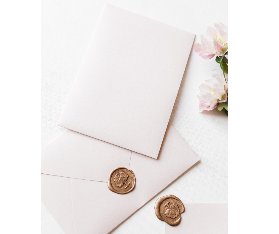 envelopes flowers and wax stamps in gold for wedding photographer Amy Harper
