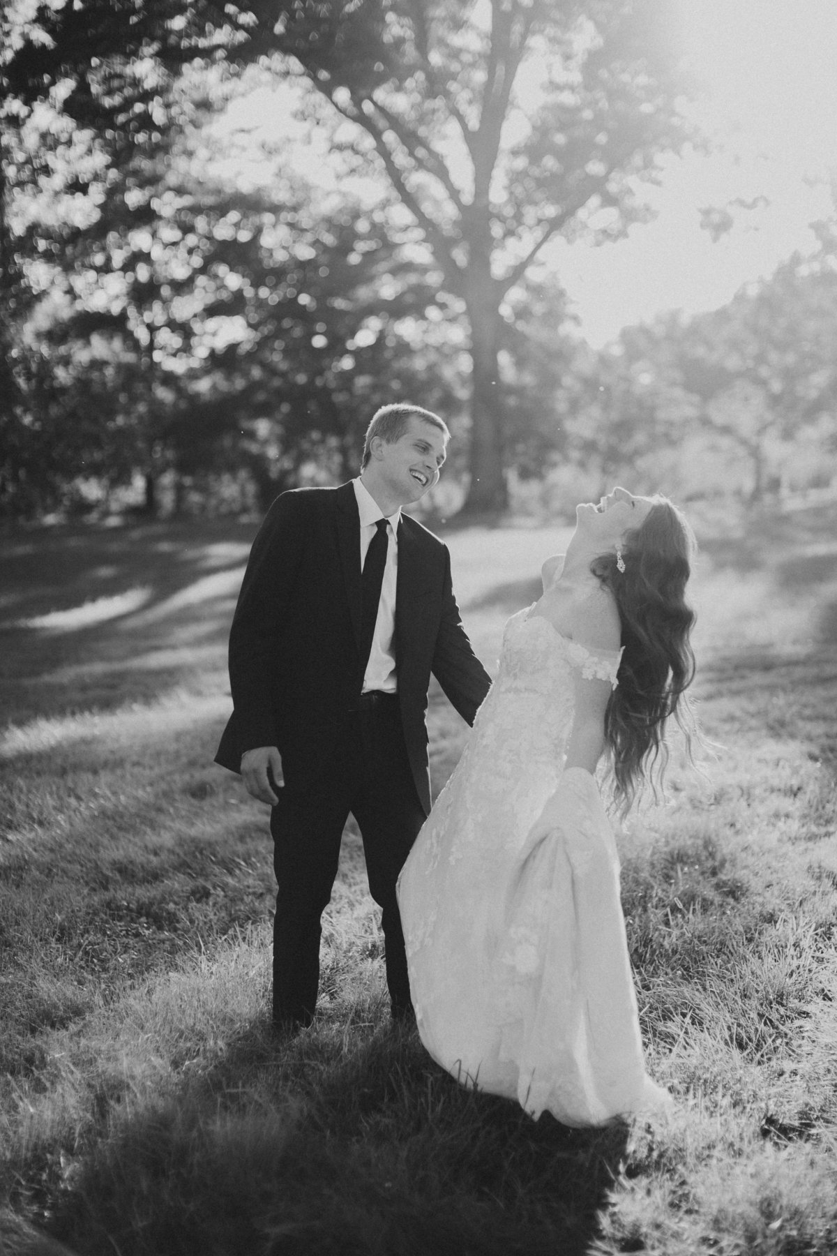 couple laughing during outdoor bridal portraits