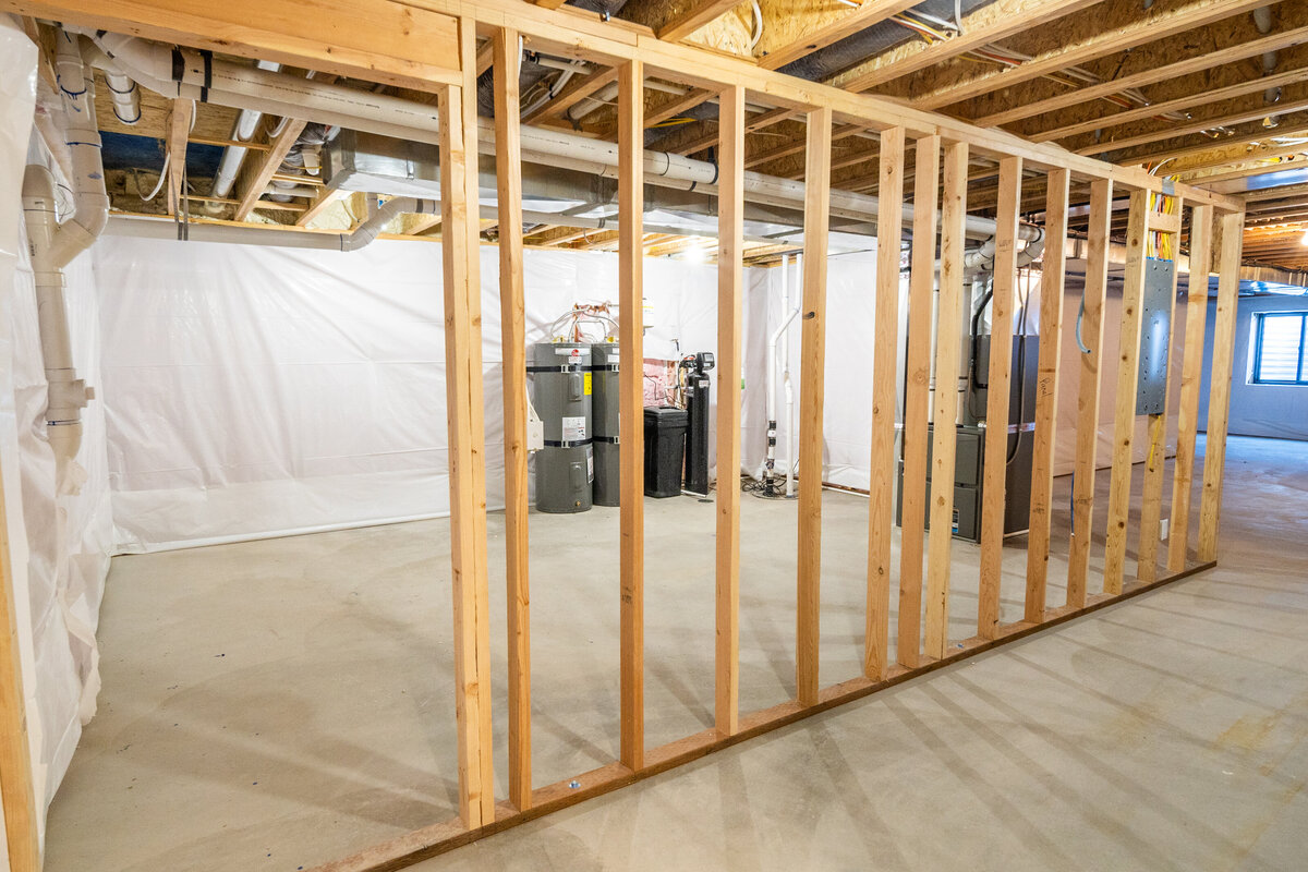 new-house-unfinished-framed-basement