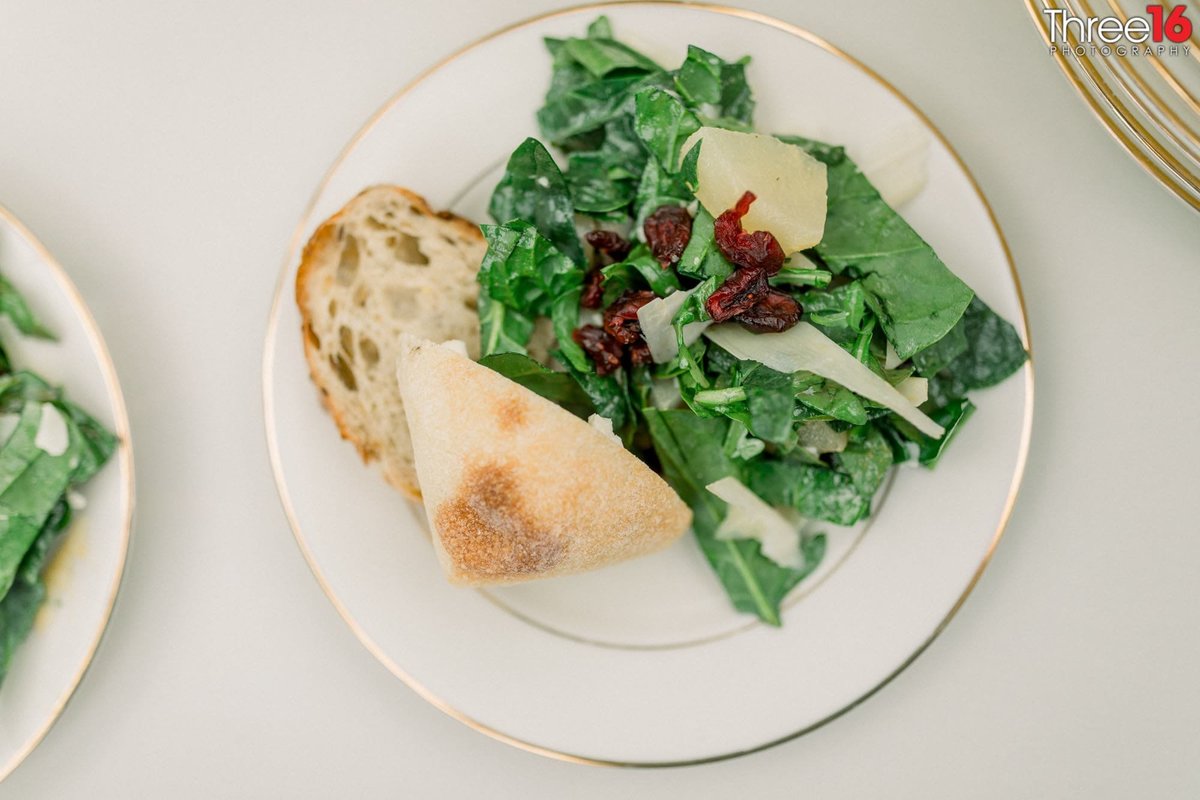 Salad and Ciabatta Bread gets dinner off good at wedding reception