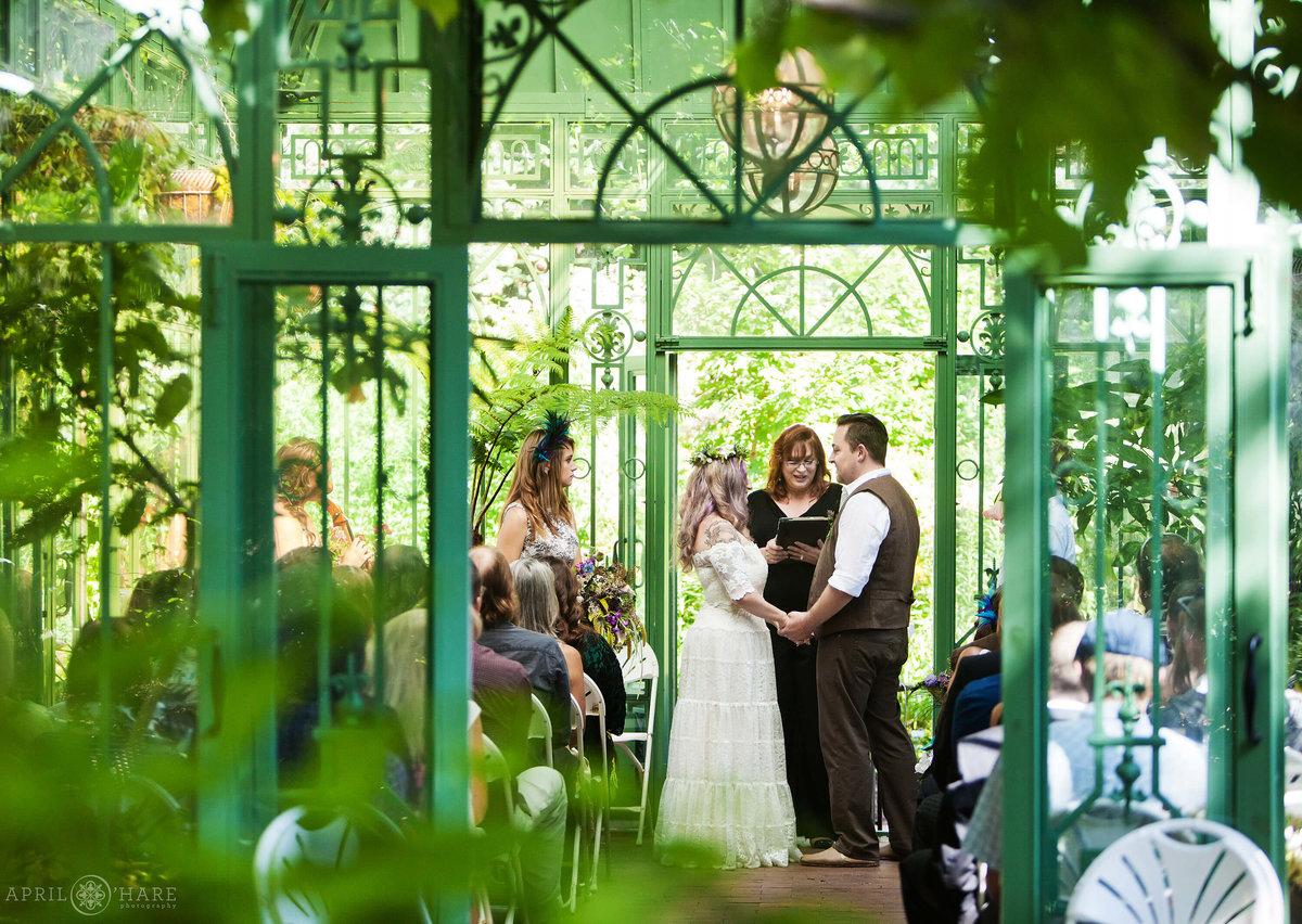 Gorgeous wedding in the green solarium at Woodland Mosaic Gardens Denver Botanic Gardens Colorado