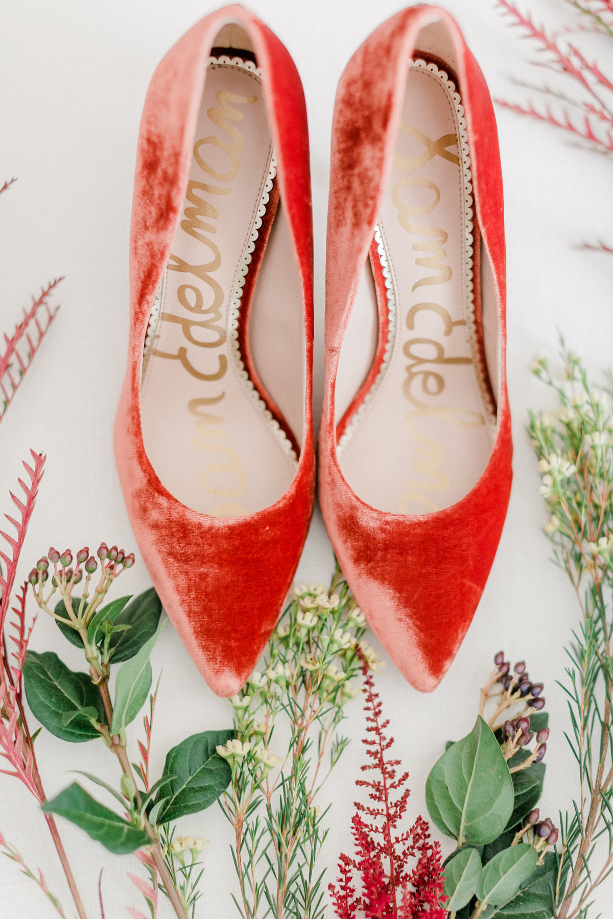 Detailed photo of bride's shoes with selected flowers