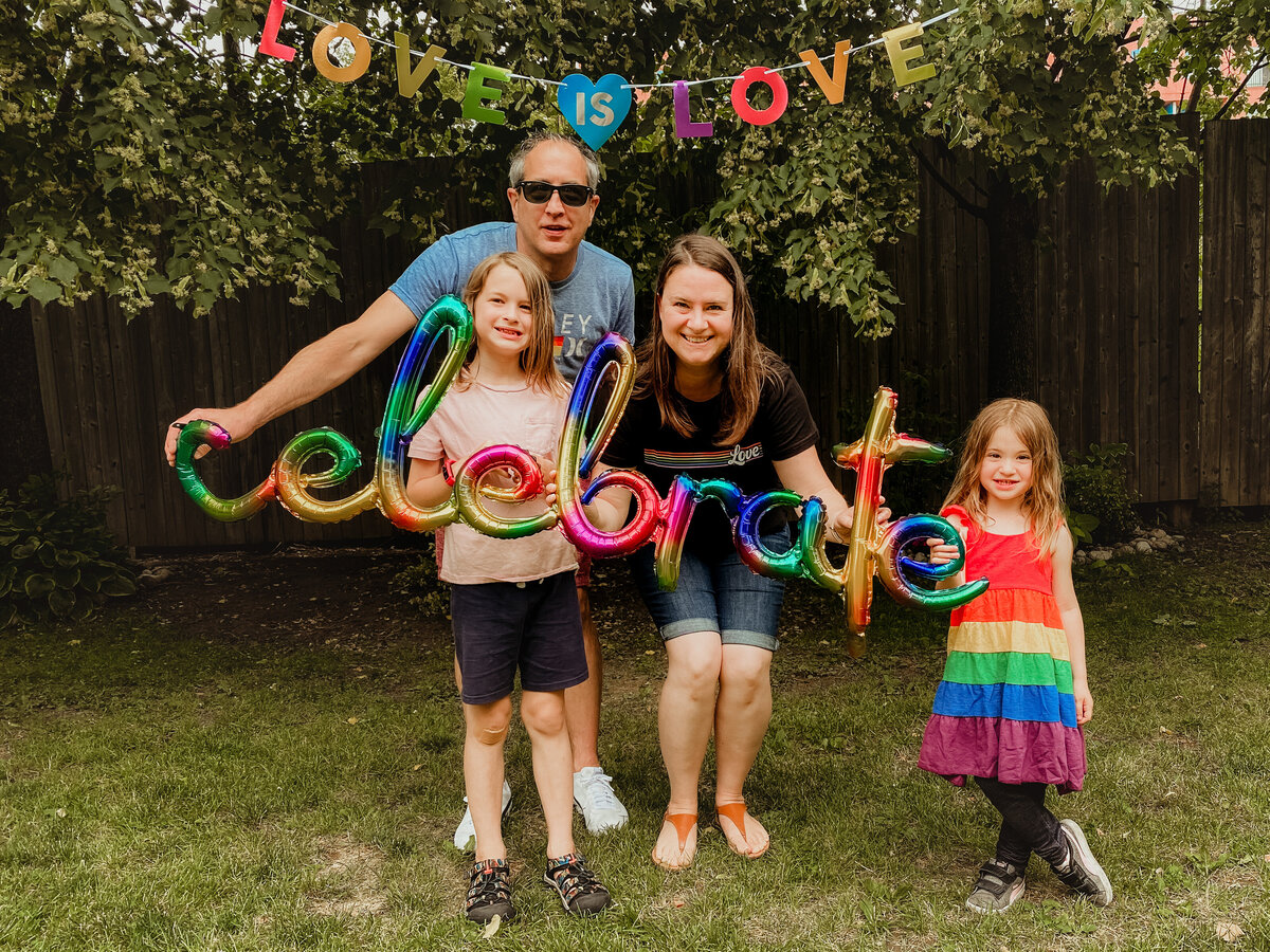 family celebrating pride month