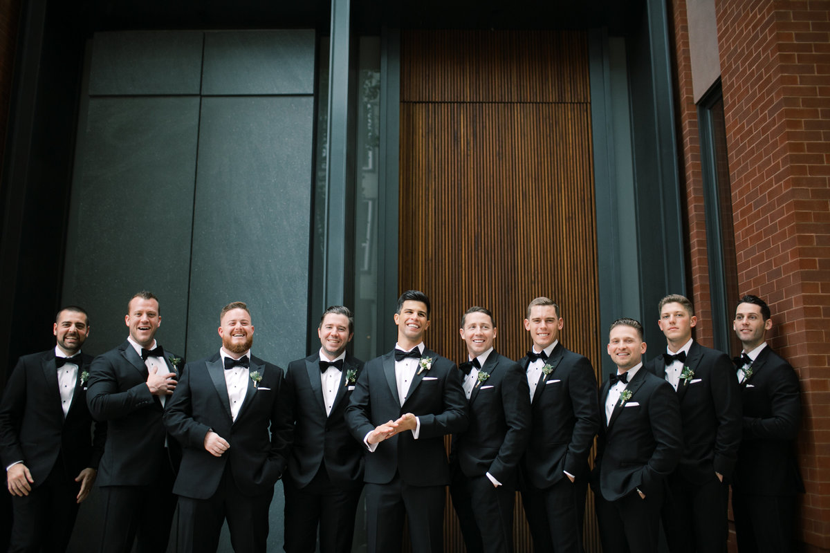 groomsmen wearing tuxedos on wedding day