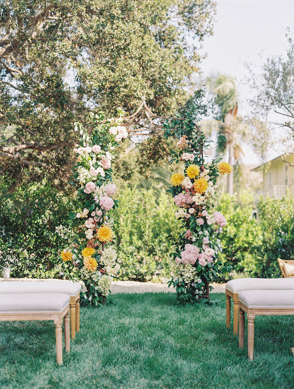 ceremony floral arch and benches