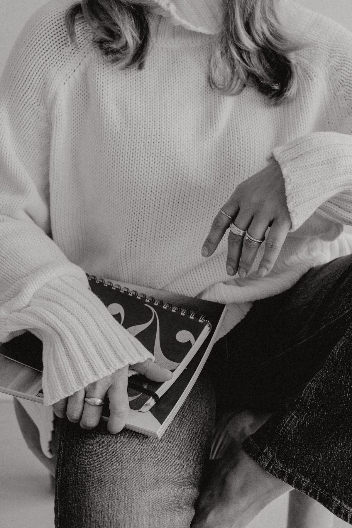 kaboompics_woman-in-a-white-sweater-jewelry-laptop-work-fashion-29460