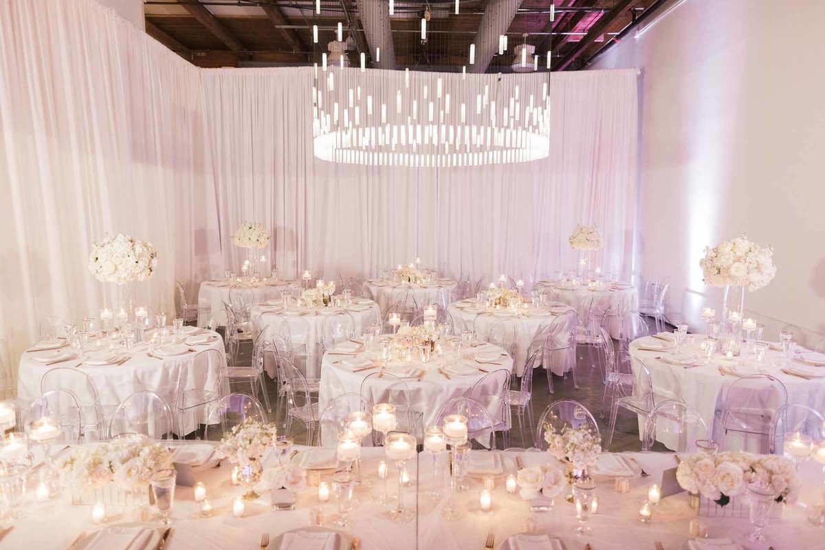 Stunning white wedding filled with candles and white floral designed by Flora Nova Design Seattle