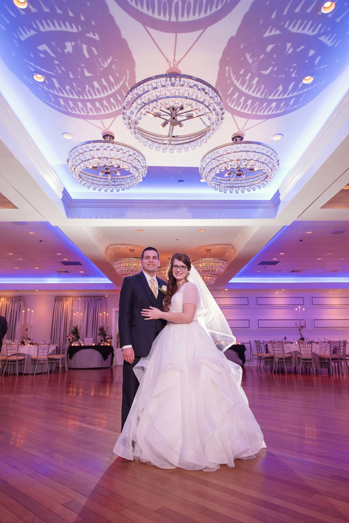 Bride and groom at the ballroom at Watermill Caterers