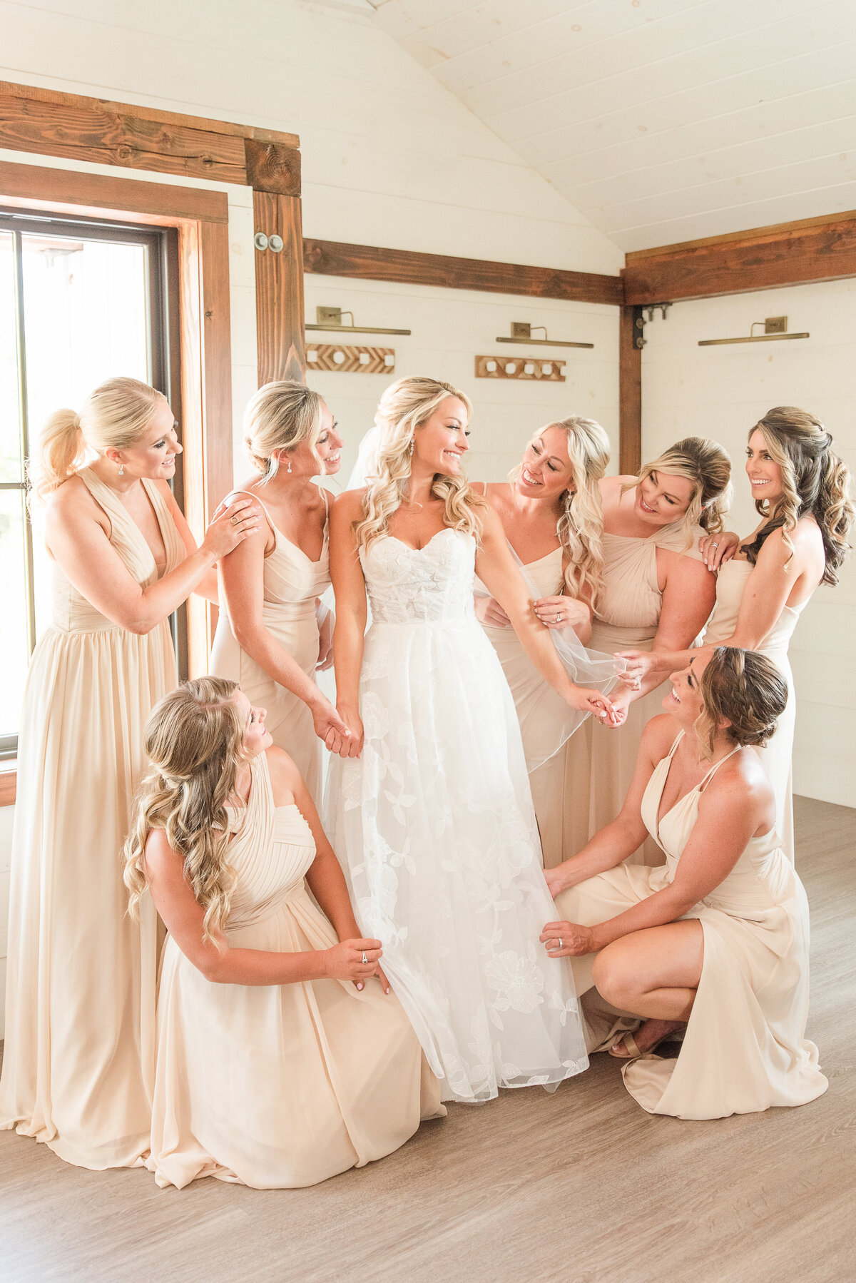 bride surrounded by bridesmaids kent island resort