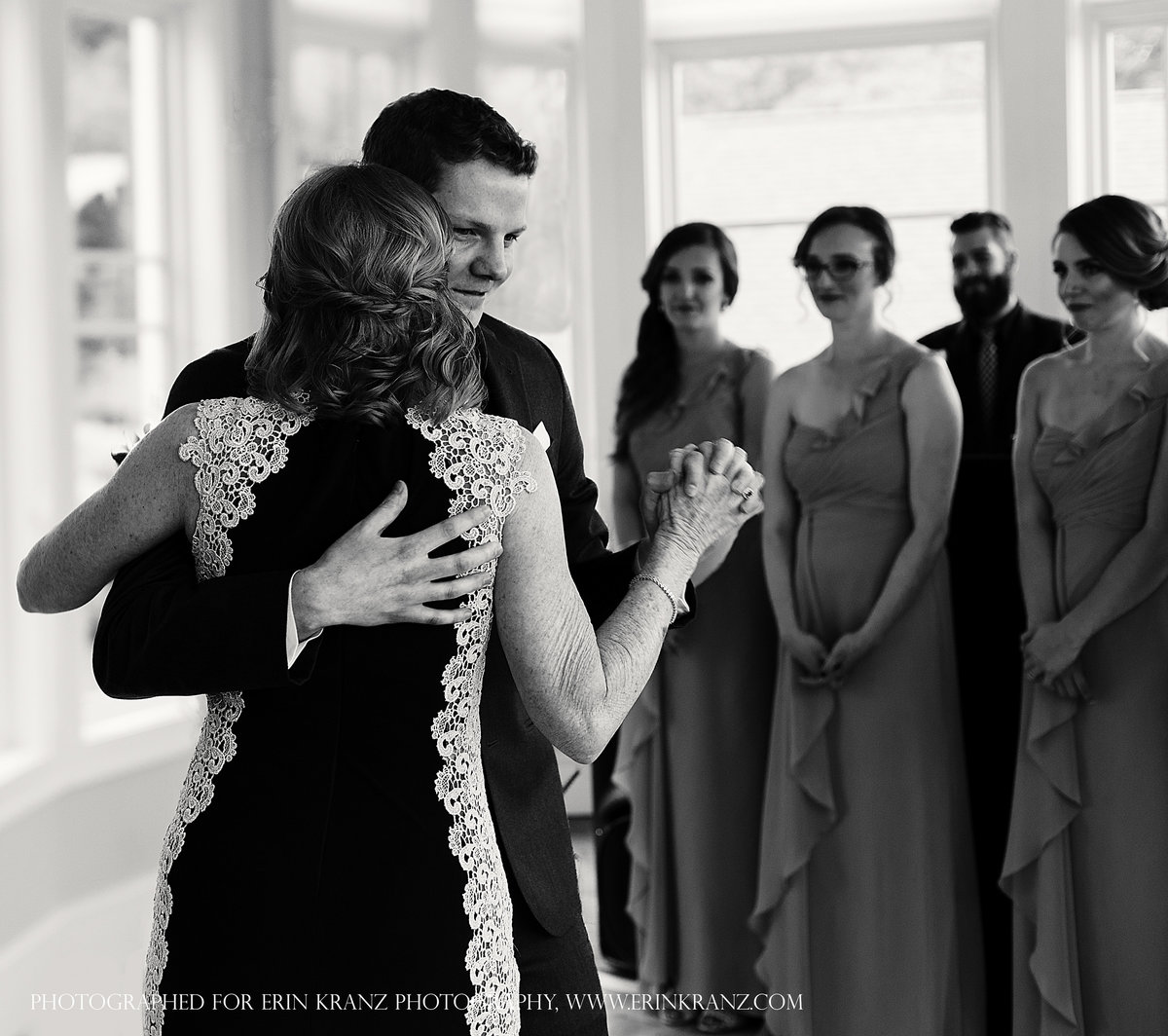 charlotte wedding photographer jamie lucido captures the mother son dance while bridesmaids look on