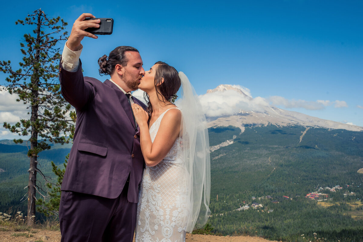 bride and groom doing selfie