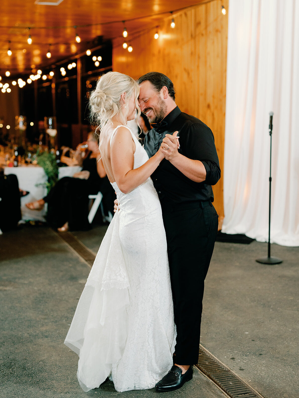 Bride and groom share first dance in the stables at salamander resort