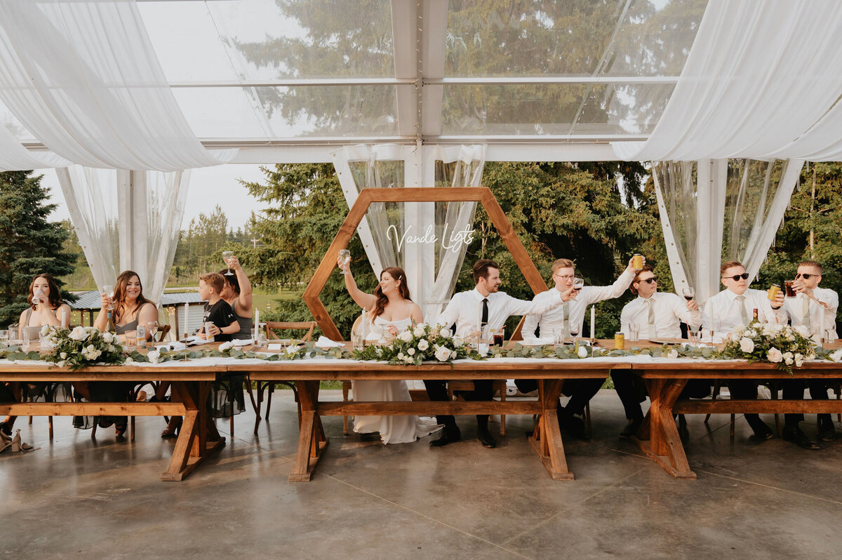 Tented reception at Pine & Pond, a natural picturesque wedding venue in Ponoka, AB, featured on the Brontë Bride Vendor Guide.