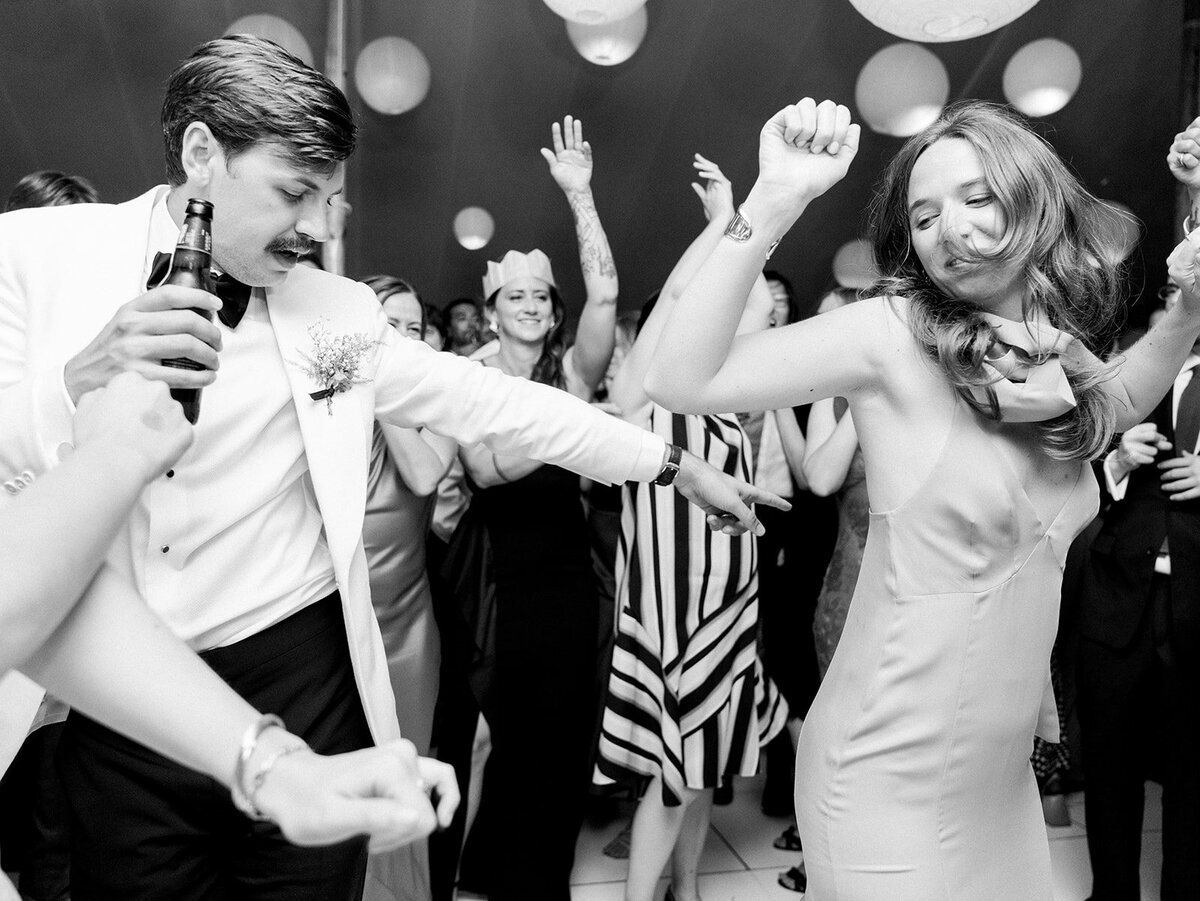 bride and groom dance on the dance floor to their favorite song at their wedding reception