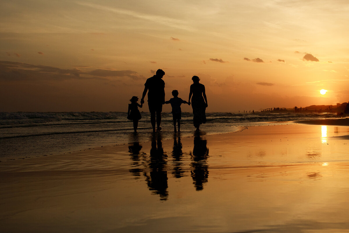 silhouette of family at 30a beach