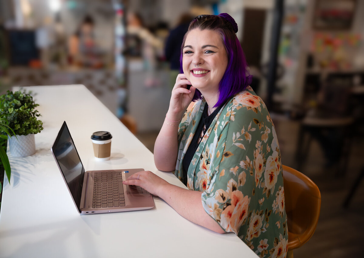 A-Social-Media-Manager-smiles-during-branding-photoshoot-at-Coffee-Bar-Bel-Air