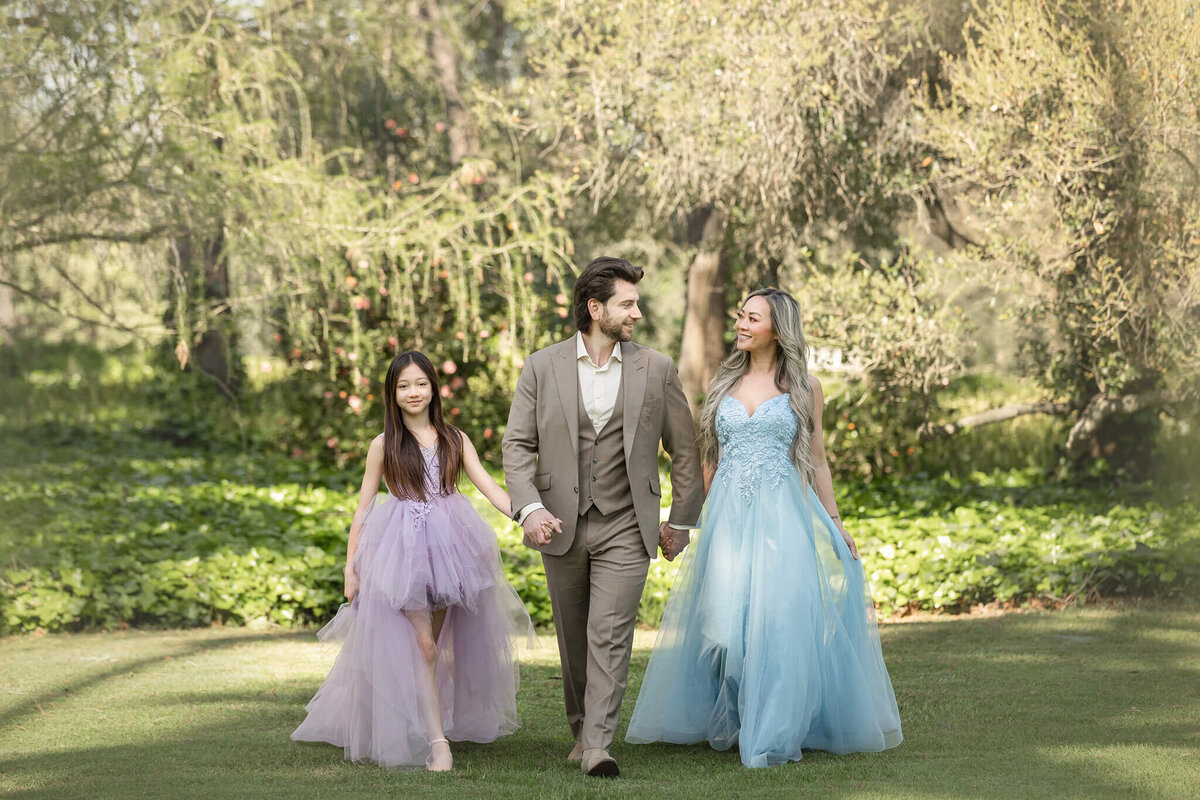 Family walking through the grass in Los Angeles by Elsie Rose Photography