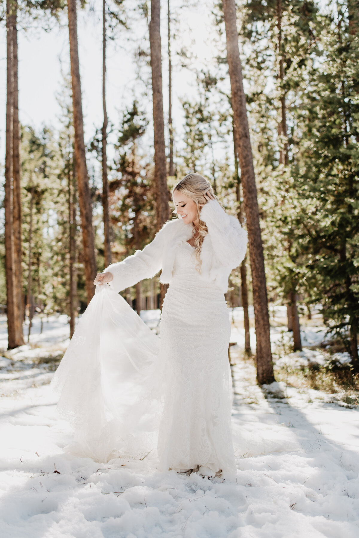 Jackson Hole Photographers capture bride holding dress