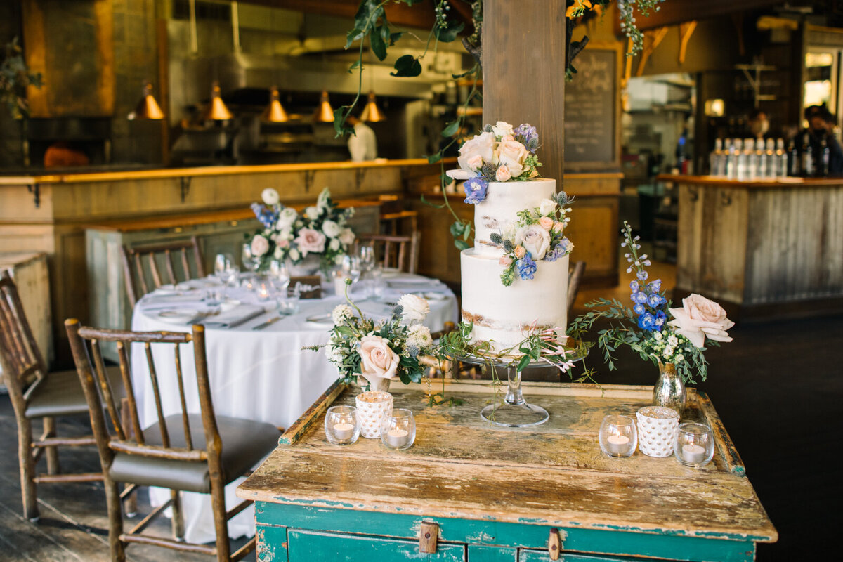 Beautiful and elegant cake table at River Cafe, a riverside wedding venue in downtown Calgary, featured on the Brontë Bride Vendor Guide.