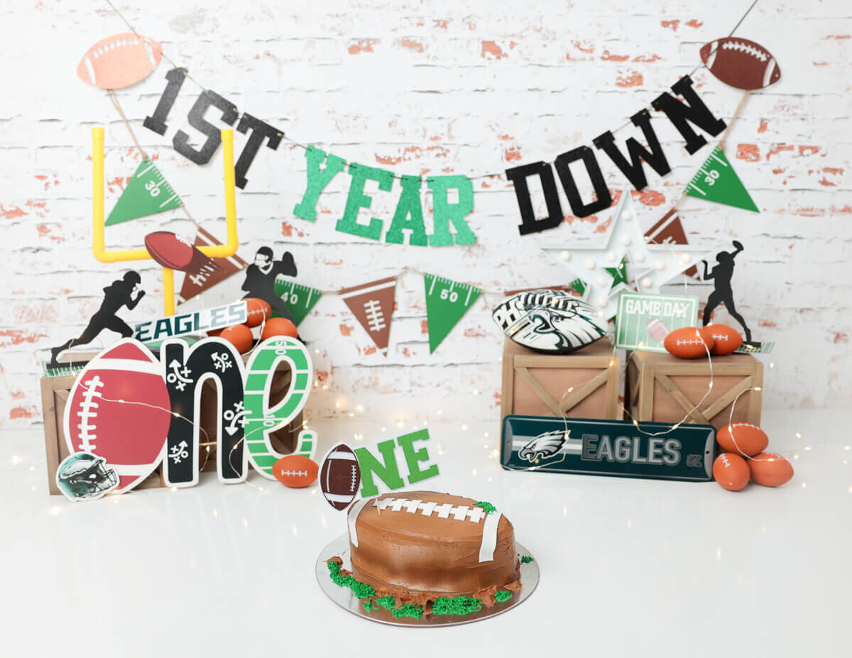 A football-themed cake smash celebration in Rochester, NY.
