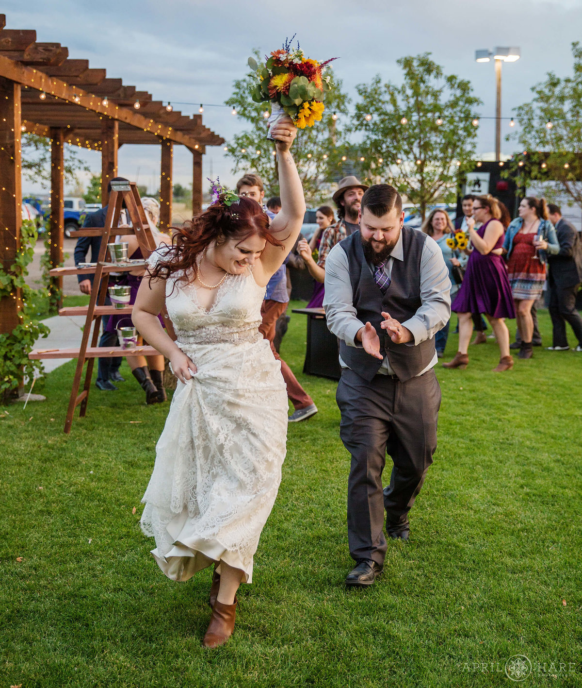 Celebrating at an outdoor Colorado wedding reception at Balistreri Vineyard