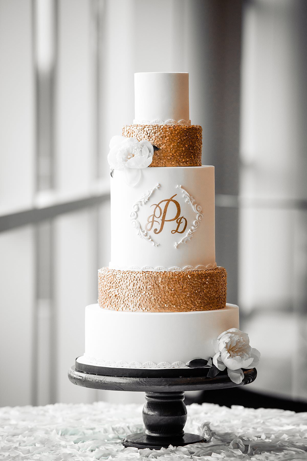 gold and ivory five tier wedding cake with monogram