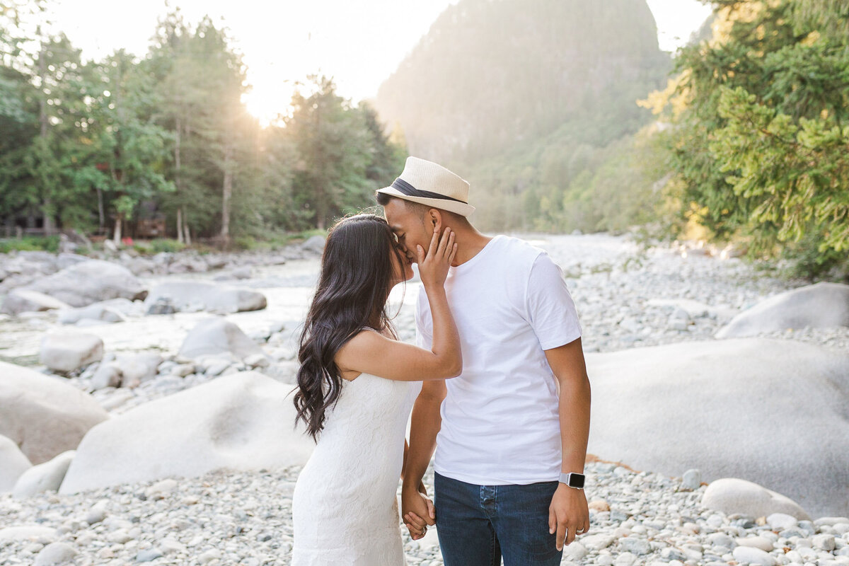 Bride-and-groom-kiss-at-their-mountain-and-river-elopement-near-Seattle-WA-photo-by-Joanna-Monger-Photography-