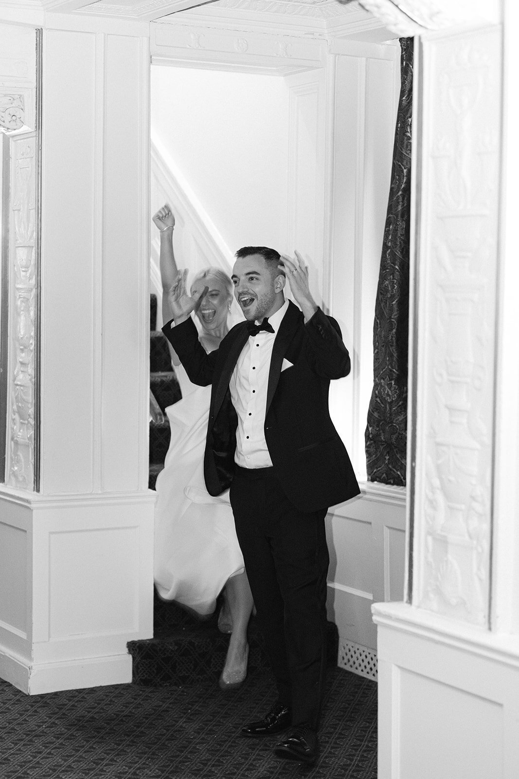 Bride and groom celebrating at the Omni William Penn Hotel wedding in Pittsburgh