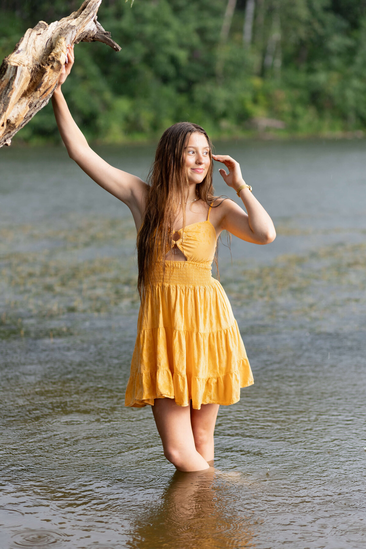girl in orange dress by the lake