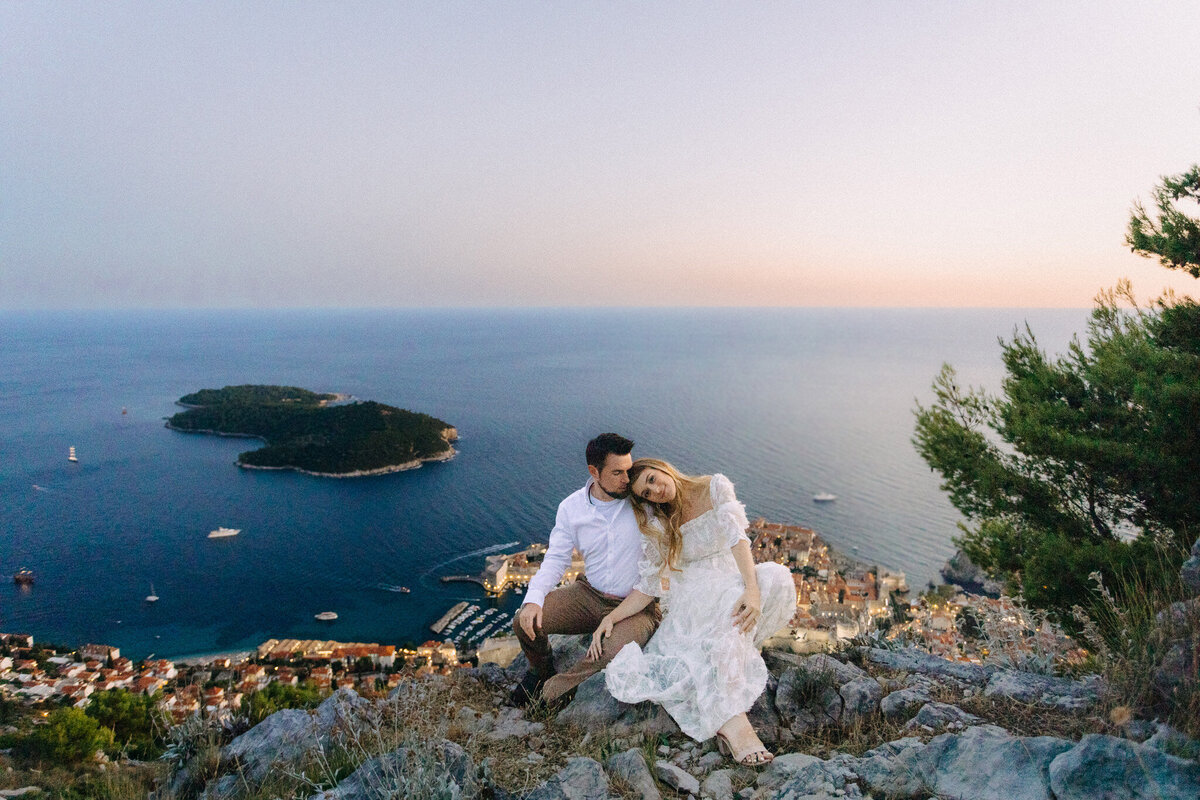 bride and groom on honeymoon in dubrovnik with photographer