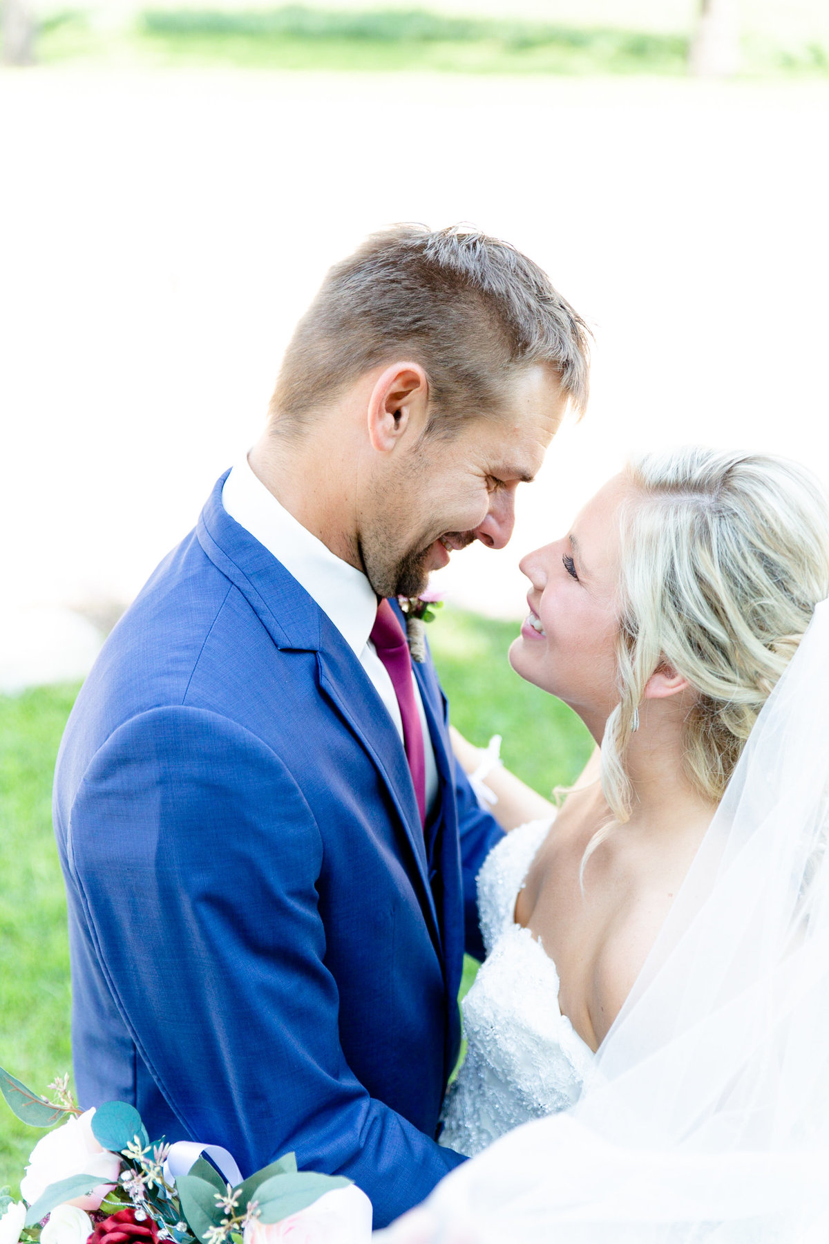 Bride and groom share a moment of joy before wedding ceremony begins