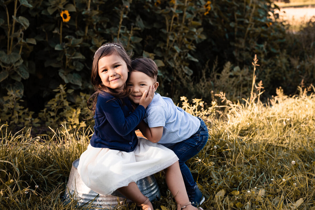 Siblings snuggling for Toronto family photographer