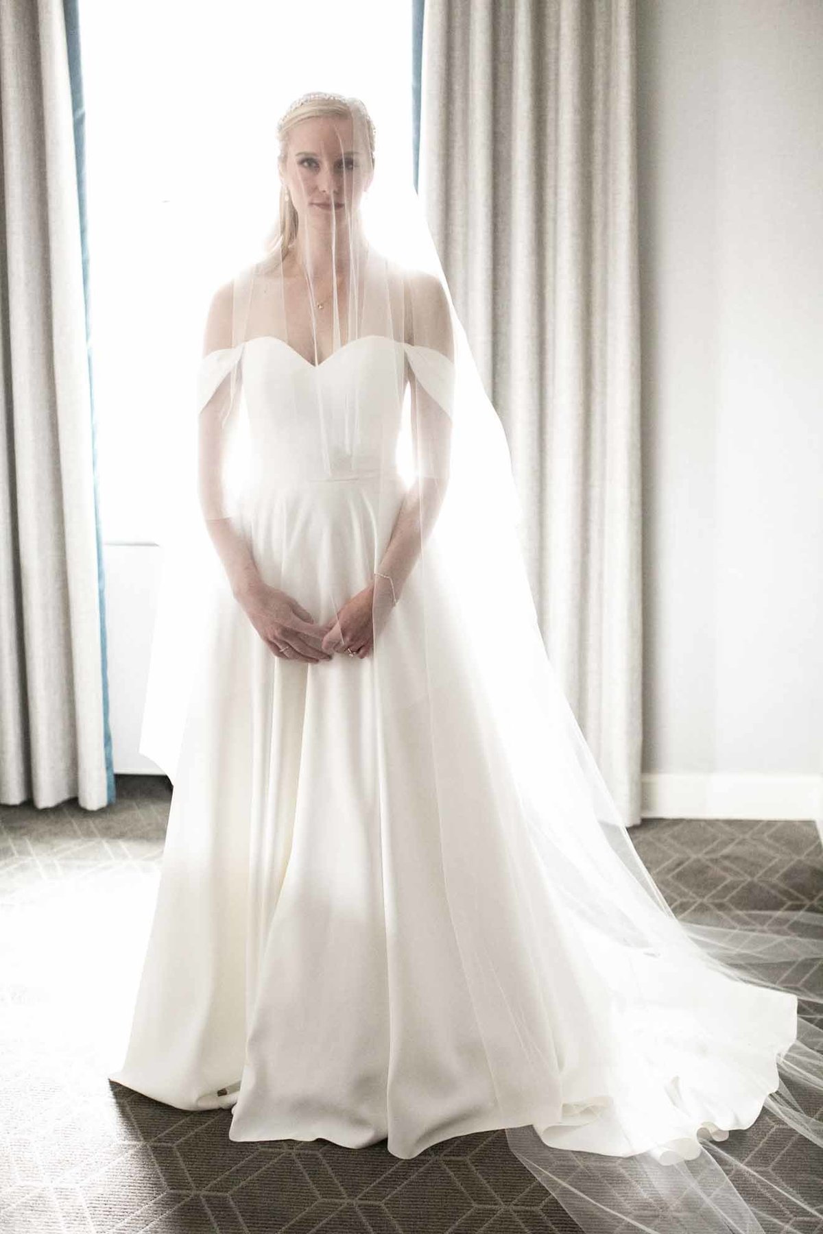 Seattle bride in long white vail and white silk wedding dress
