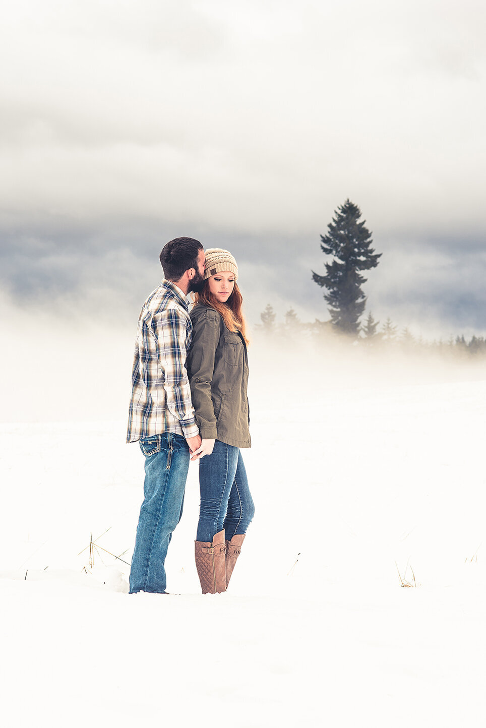 engaged couple in snow